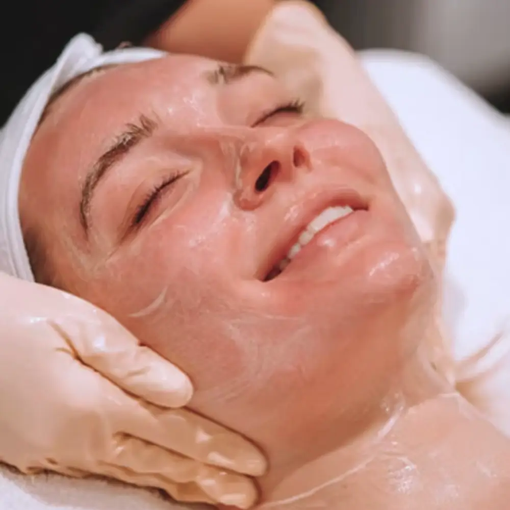 woman getting custom acne facial, firming facial, exosome facial i Los Gatos at The Skin Maven