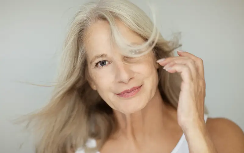 woman experiencing menopause but thriving with beautiful skin and hair navigating menopause skin changes